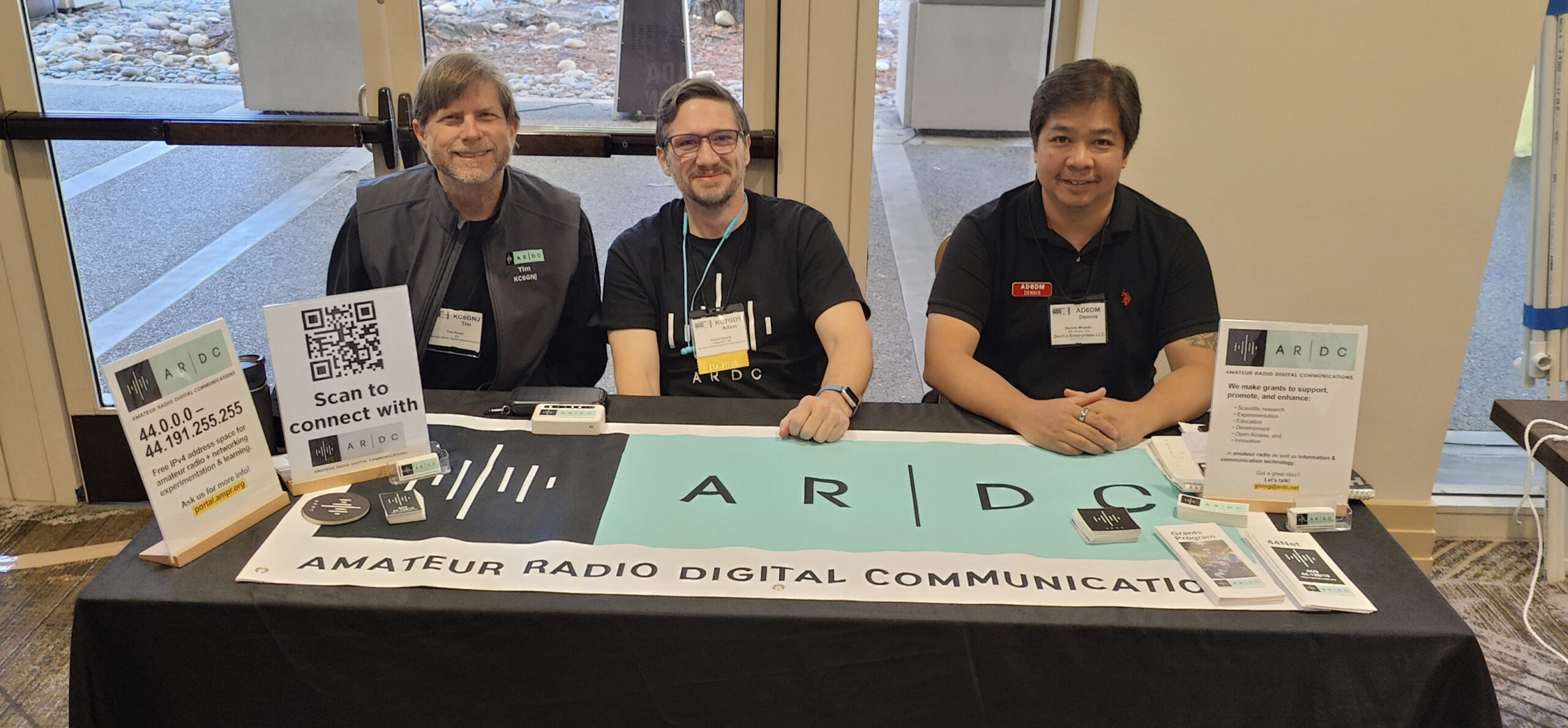 Tim Požar KC6GNJ, Adam Lewis KC7GDY, and Dennis Mojado AD6DM at the ARDC booth at Pacificon 2024